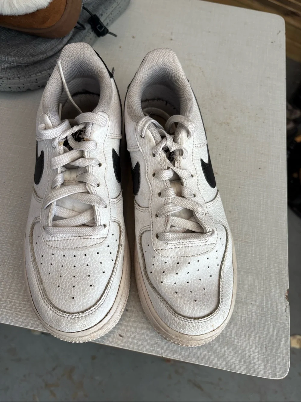Nike White Leather Sneakers with Black Swoosh